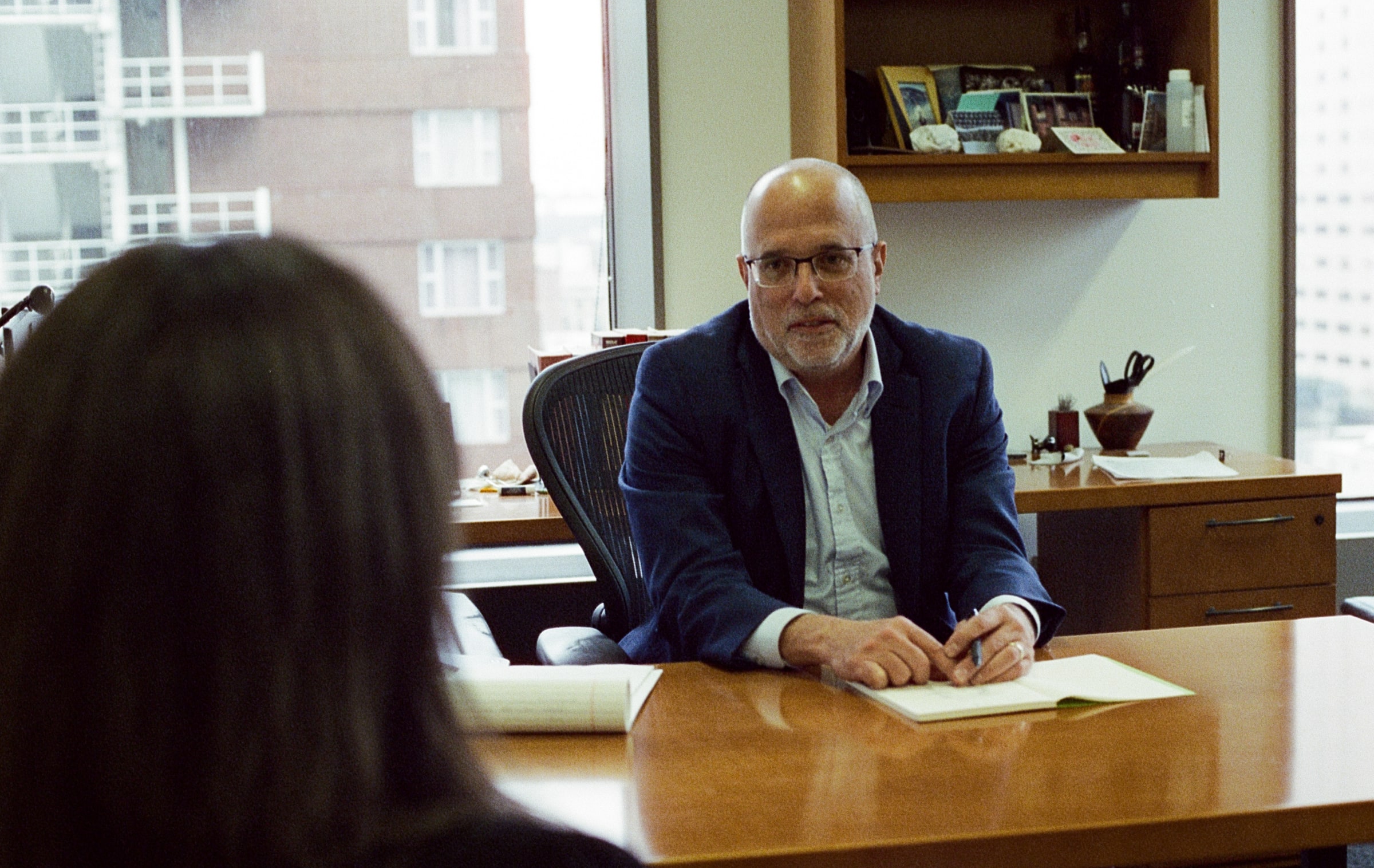 David Suger sitting at desk